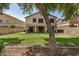 Large backyard with grassy area, patio, and privacy fence, perfect for entertaining at 16386 W Sierra St, Surprise, AZ 85388
