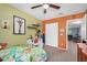 Bright bedroom features an accent wall, a ceiling fan, and a spacious closet at 16386 W Sierra St, Surprise, AZ 85388