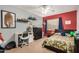 Bedroom displays a ceiling fan, a closet, and decoratively adorned shelves at 16386 W Sierra St, Surprise, AZ 85388