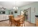 Open floor plan showing dining room with table and chairs near sliding glass door to backyard at 16386 W Sierra St, Surprise, AZ 85388