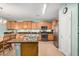 Spacious kitchen with granite countertops, stainless steel appliances, and wooden cabinets at 16386 W Sierra St, Surprise, AZ 85388