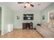 Cozy living room with tile flooring, ceiling fan, and a comfortable reclining sofa at 16386 W Sierra St, Surprise, AZ 85388