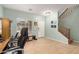 Home office features tile flooring, natural light, and convenient access to the staircase at 16386 W Sierra St, Surprise, AZ 85388