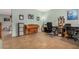 A home office features a piano, desk, computer, and assorted decorative elements at 16386 W Sierra St, Surprise, AZ 85388