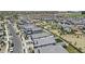 A bird's eye view of a neighborhood showcasing homes with landscaping and community green spaces at 16617 W Desert Mirage Dr, Surprise, AZ 85388
