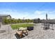 Landscaped backyard with pavers, grass, shed, and a fence at 16617 W Desert Mirage Dr, Surprise, AZ 85388