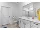 White bathroom with a vanity, toilet and shower at 16617 W Desert Mirage Dr, Surprise, AZ 85388