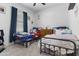 Cozy bedroom with two twin beds, blue accents, and neutral color scheme at 16617 W Desert Mirage Dr, Surprise, AZ 85388