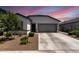 Beautiful single-story home featuring a two-car garage and landscaped front yard at 16617 W Desert Mirage Dr, Surprise, AZ 85388