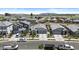Street view of single Gathering homes featuring well-maintained front yards and attached garages at 16617 W Desert Mirage Dr, Surprise, AZ 85388