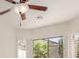 Airy bedroom with a ceiling fan and window offering outdoor views at 16813 S 30Th Ave, Phoenix, AZ 85045
