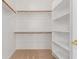 Walk-in closet with ample shelving and hanging space, ideal for organization at 16813 S 30Th Ave, Phoenix, AZ 85045