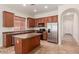 Eat-in kitchen boasts a center island, stainless appliances, and lots of cabinets at 16813 S 30Th Ave, Phoenix, AZ 85045