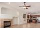 Cozy living area with a fireplace, tile flooring, and an open view to the kitchen at 16813 S 30Th Ave, Phoenix, AZ 85045