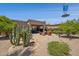 Relaxing backyard with a patio, seating area, mature trees, and desert landscaping at 17214 E Alta Loma --, Fountain Hills, AZ 85268