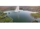 Aerial view of a lake with a fountain, and parkland areas surrounding the water at 17214 E Alta Loma --, Fountain Hills, AZ 85268