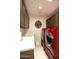 Laundry room features a sink, ample cabinetry, and modern red washer and dryer at 17214 E Alta Loma --, Fountain Hills, AZ 85268