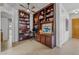 Inviting office with custom built-in bookshelves and storage, offering a functional and stylish workspace at 17214 E Alta Loma --, Fountain Hills, AZ 85268