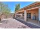 Beautiful backyard with a covered patio, decorative plants, and ample space for outdoor activities at 1880 E Birch St, Casa Grande, AZ 85122