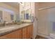 Modern bathroom featuring a double sink vanity and glass shower, offering a luxurious experience at 1880 E Birch St, Casa Grande, AZ 85122