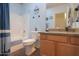 Comfortable bathroom featuring granite counters, blue accents and shower/tub for a refreshing feel at 1880 E Birch St, Casa Grande, AZ 85122