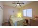 Cozy bedroom with a ceiling fan and a window, creating a relaxing and inviting atmosphere at 1880 E Birch St, Casa Grande, AZ 85122