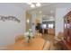 Dining area with tile floors, decorative lighting and views of the kitchen in an open floor plan at 1880 E Birch St, Casa Grande, AZ 85122