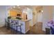 Open kitchen features tile floor, maple cabinets, granite counters and bar seating at 1880 E Birch St, Casa Grande, AZ 85122