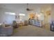 Large living room features carpet floor and provides access to the kitchen and front entry at 1880 E Birch St, Casa Grande, AZ 85122