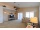 Inviting living room with carpet floor, ceiling fan, and sliding doors to back at 1880 E Birch St, Casa Grande, AZ 85122