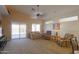Spacious living room features carpet floor, ceiling fan, and sliding door to patio at 1880 E Birch St, Casa Grande, AZ 85122
