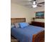 Comfortable bedroom featuring a ceiling fan, artwork, and a dresser, creating a welcoming space at 1898 N Hubbard Ln, Casa Grande, AZ 85122