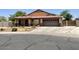 Charming single-story home featuring a well-manicured front yard at 1898 N Hubbard Ln, Casa Grande, AZ 85122