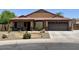Well-kept single-story home with a two car garage, landscaping, and stucco exterior at 1898 N Hubbard Ln, Casa Grande, AZ 85122