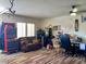 Multi-purpose garage furnished with ample storage, seating, and a workstation at 1898 N Hubbard Ln, Casa Grande, AZ 85122