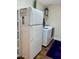 Bright laundry area featuring updated appliances and storage options at 1898 N Hubbard Ln, Casa Grande, AZ 85122