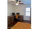 Bright office with a large desk, wood floors, and a window, ideal for productivity at 1898 N Hubbard Ln, Casa Grande, AZ 85122