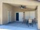 Covered patio featuring a ceiling fan, four chairs and a table at 1898 N Hubbard Ln, Casa Grande, AZ 85122