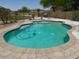 Inviting backyard pool featuring a brick trim and wrought iron safety fence at 1898 N Hubbard Ln, Casa Grande, AZ 85122