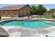Backyard pool featuring a brick trim and wrought iron safety fence at 1898 N Hubbard Ln, Casa Grande, AZ 85122