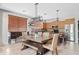 Eat-in kitchen featuring a spacious table with pendant lighting, wood cabinets and stainless steel appliances at 19339 E Mockingbird Dr, Queen Creek, AZ 85142