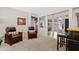 Comfortable living room features leather recliners, neutral paint, and multiple framed pieces of art at 19339 E Mockingbird Dr, Queen Creek, AZ 85142