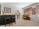 Inviting living area boasts a bar, artwork, and a piano near a window, creating a relaxing atmosphere at 19339 E Mockingbird Dr, Queen Creek, AZ 85142
