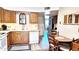 Traditional eat-in kitchen with wood cabinets, white appliances, and tile floors at 2064 S Farnsworth Dr # 38, Mesa, AZ 85209