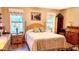 Inviting bedroom with a comfy bed, soft lighting, and serene decor at 2064 S Farnsworth Dr # 38, Mesa, AZ 85209