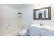 Bathroom with a white vanity, framed mirror, and a tub with shower at 222 W Brown Rd # 72, Mesa, AZ 85201