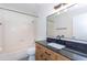 Clean bathroom offers a shower-tub combo, modern vanity, and framed mirror at 222 W Brown Rd # 72, Mesa, AZ 85201