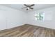 Neutral bedroom with a ceiling fan, closet and shuttered windows at 222 W Brown Rd # 72, Mesa, AZ 85201