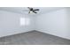 Bright bedroom featuring neutral carpet and shuttered window at 222 W Brown Rd # 72, Mesa, AZ 85201
