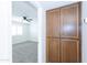 Bedroom featuring cabinet storage, ceiling fan and access to a bedroom at 222 W Brown Rd # 72, Mesa, AZ 85201